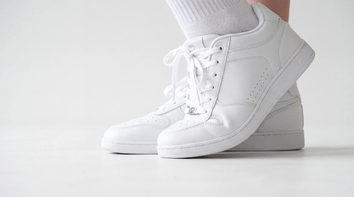 Close-up of feet in Flow 2 White dance sneakers